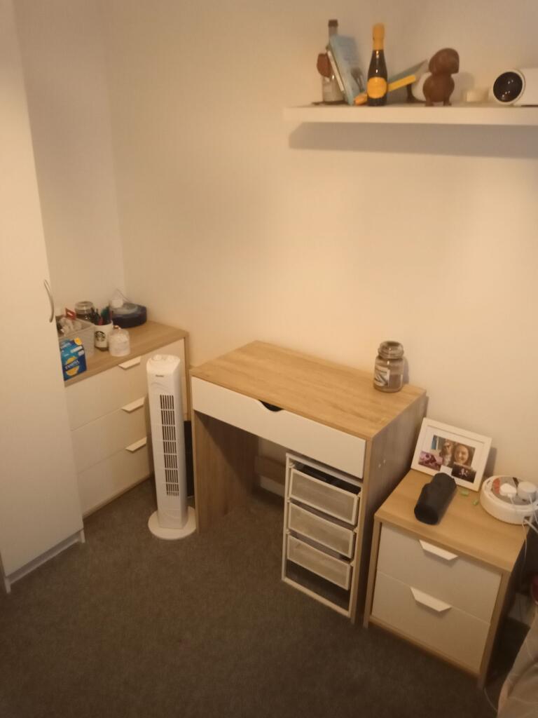 Neat furnished bedroom corner with coordinated ...