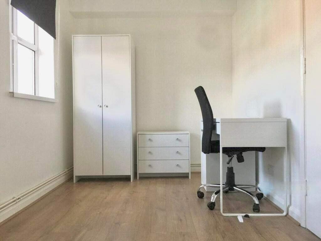 Bright and spacious double bedroom featuring a ...