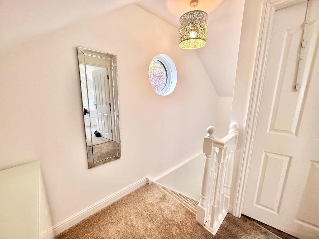 STAIRCASE TO THE SECOND FLOOR LANDING