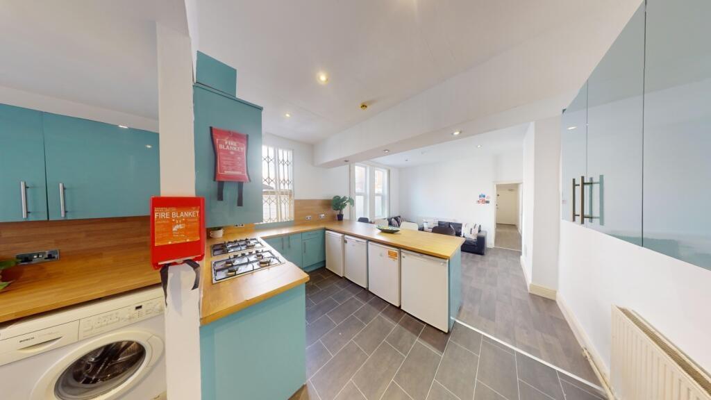 Bright and modern kitchen with ample countertop...