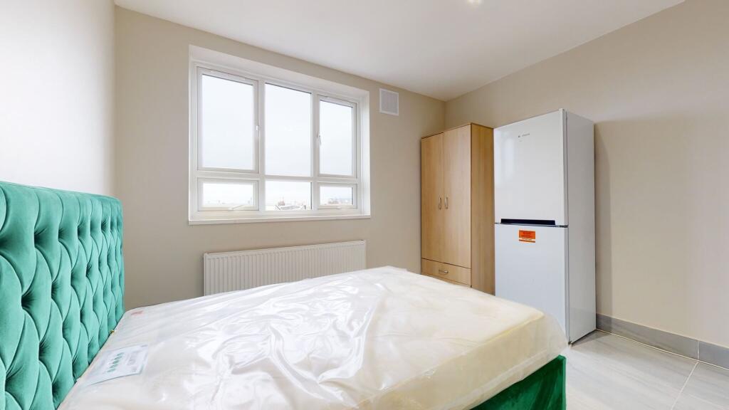 Bright and inviting master bedroom with a bold ...