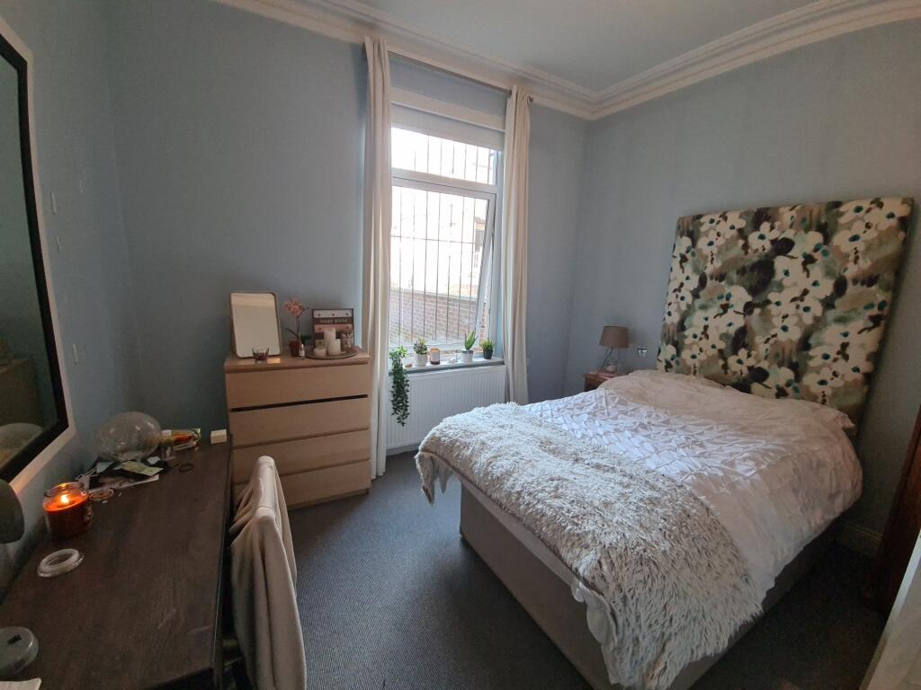 A welcoming bedroom featuring a comfortable dou...