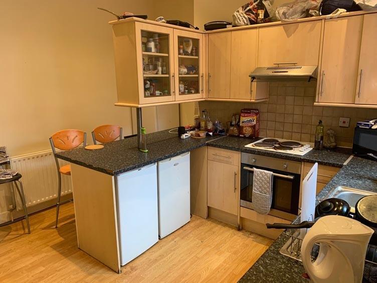 A functional kitchen with ample cabinetry and w...