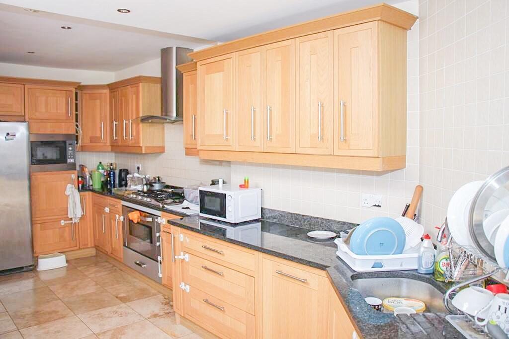 Bright and spacious kitchen featuring extensive...
