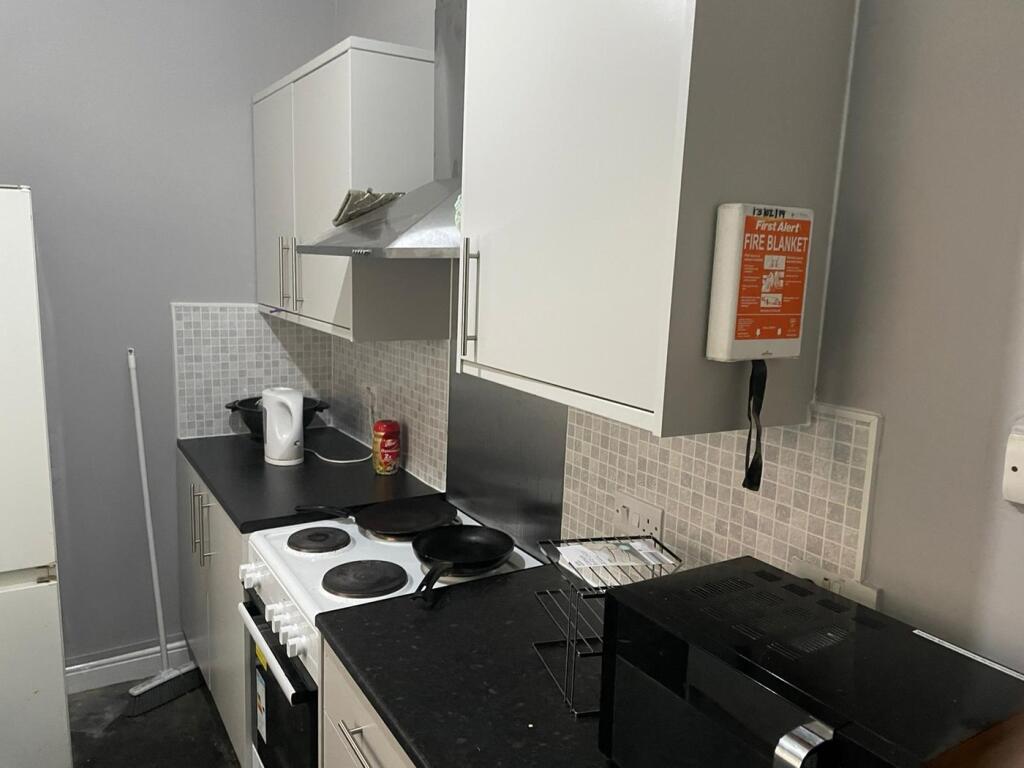 A functional kitchenette featuring modern appli...