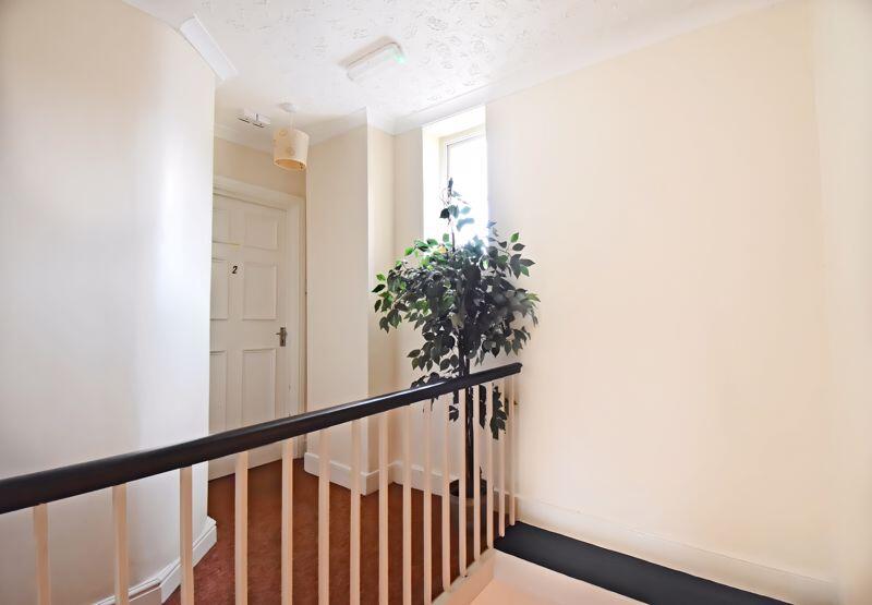 Communal hall and entrance to Flat 2