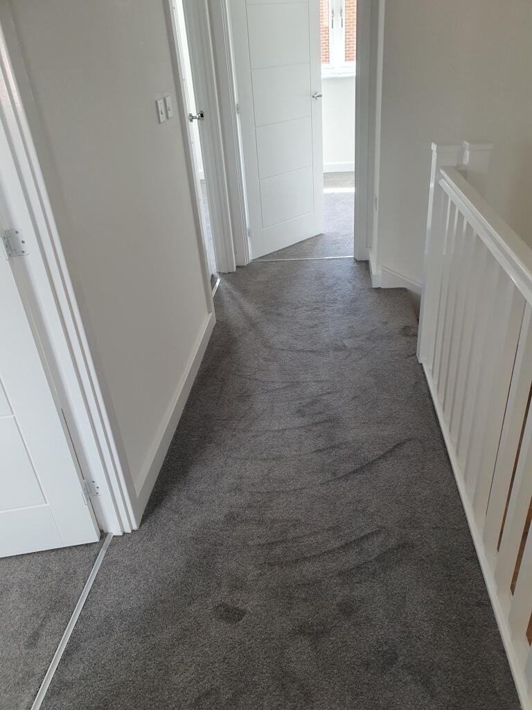 Bright and inviting hallway featuring modern de...