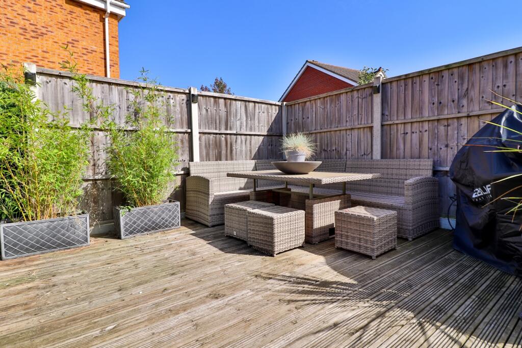 Decking area in wrap around garden