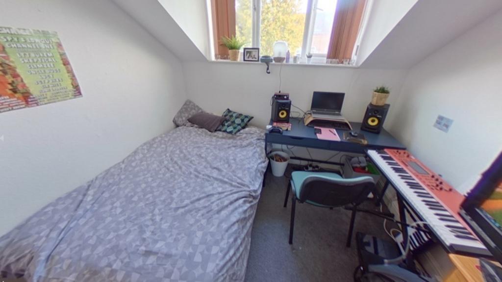 A cozy double bedroom featuring a comfortable d...