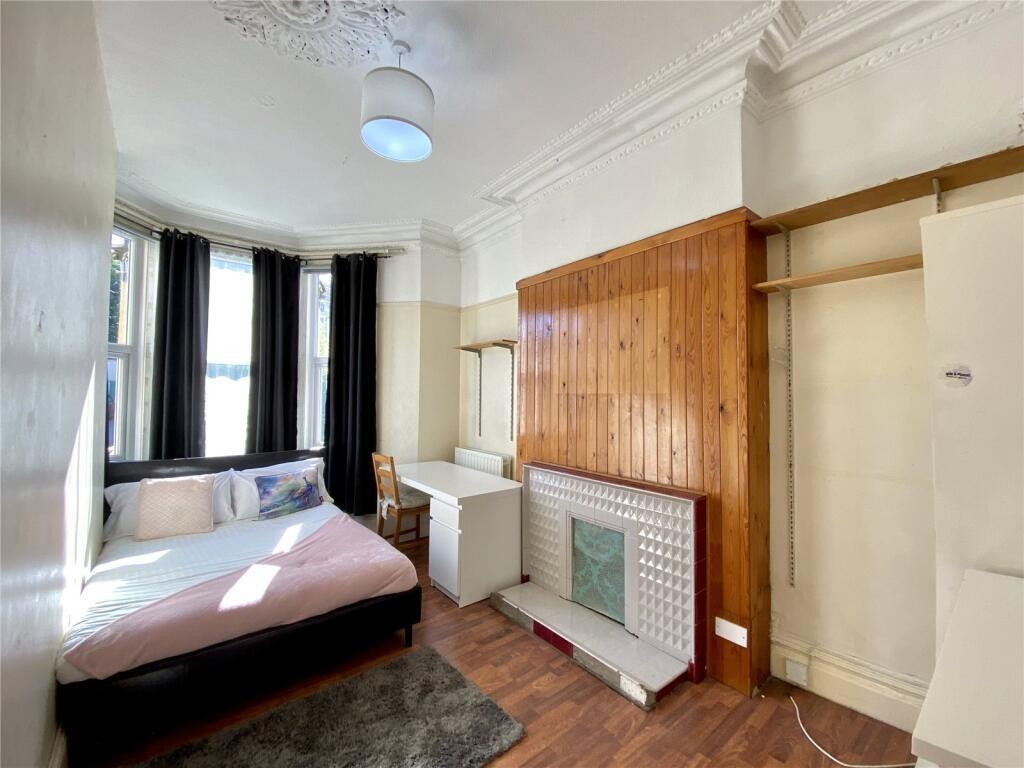 Bright and cozy double bedroom featuring large ...