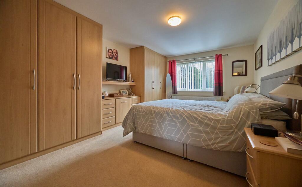 BEDROOM ONE TO FRONT