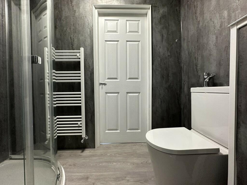A modern, well-maintained bathroom with a clean...