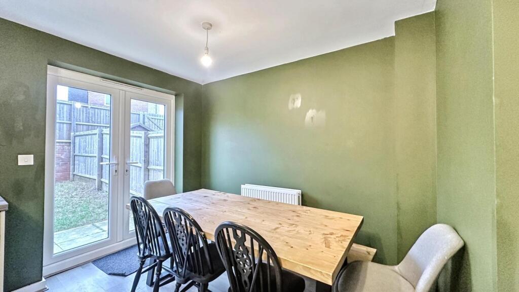 A bright and inviting kitchenette with a spacio...