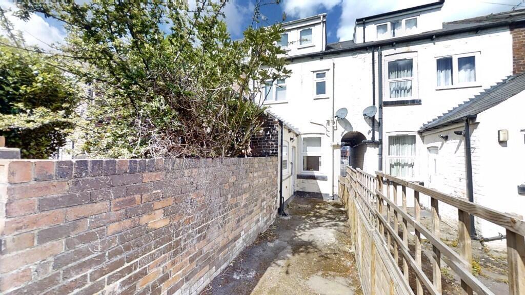 Charming terraced house exterior with natural l...