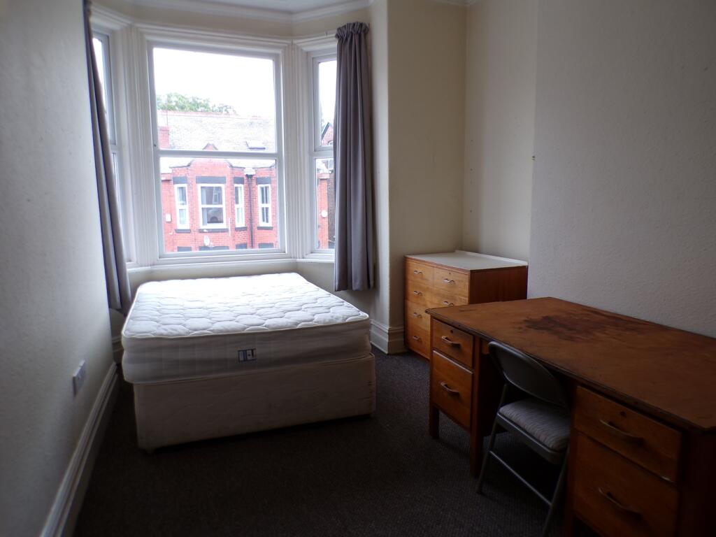 A bright and spacious double bedroom featuring ...