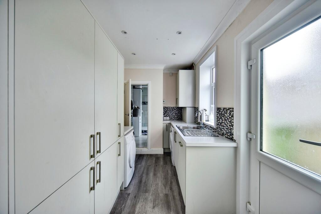 Utility Space With View Of The Family Bathroom