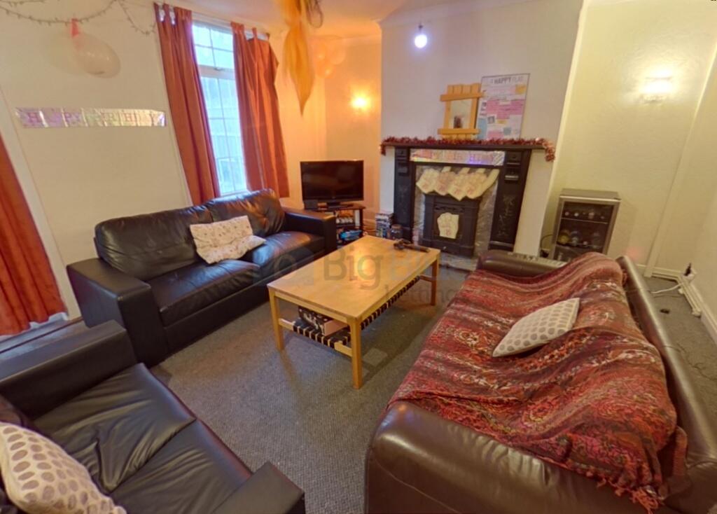 A warm and inviting living room featuring comfo...