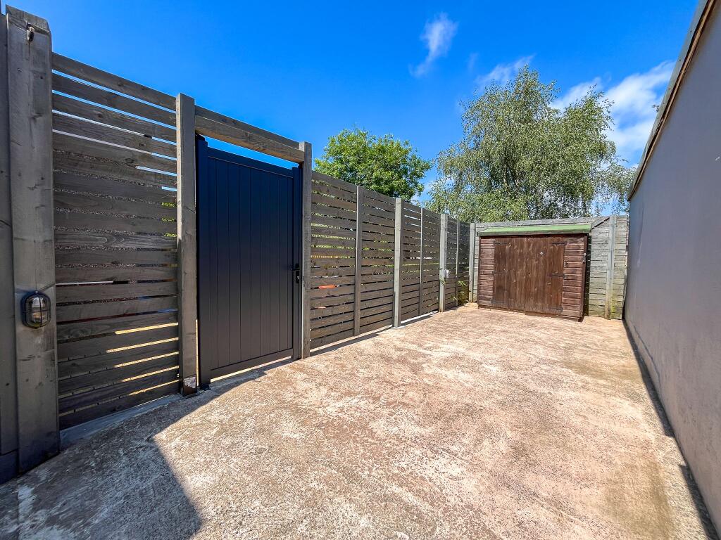 Driveway with EV charging point and side access to