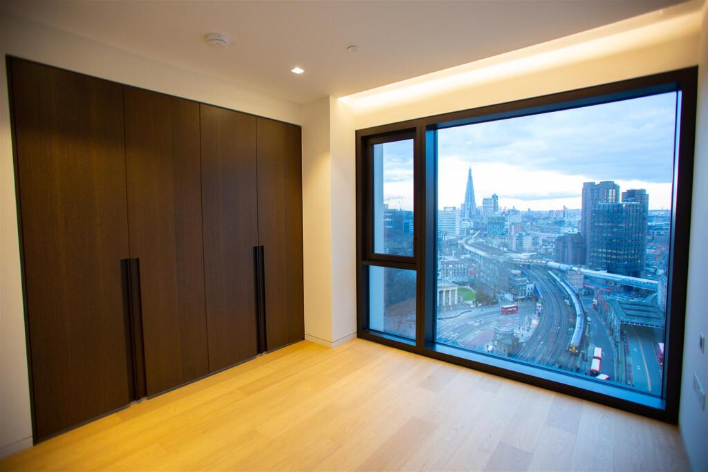 Bedroom corner window wardrobe.jpg