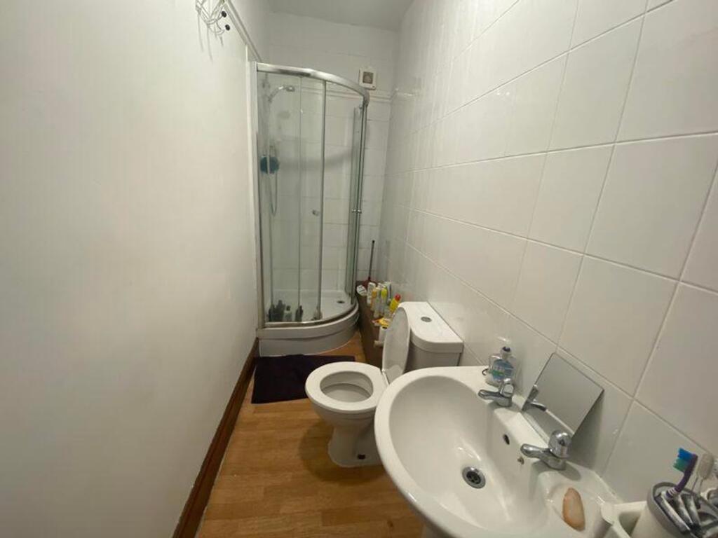A clean and functional bathroom featuring a mod...