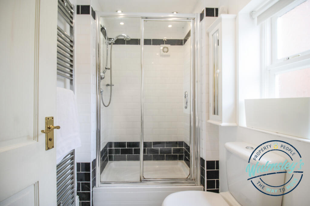 Shower room to right wing
