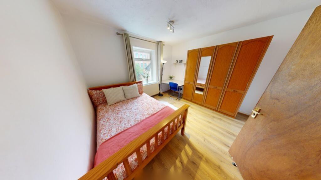 A bright and inviting double bedroom featuring ...