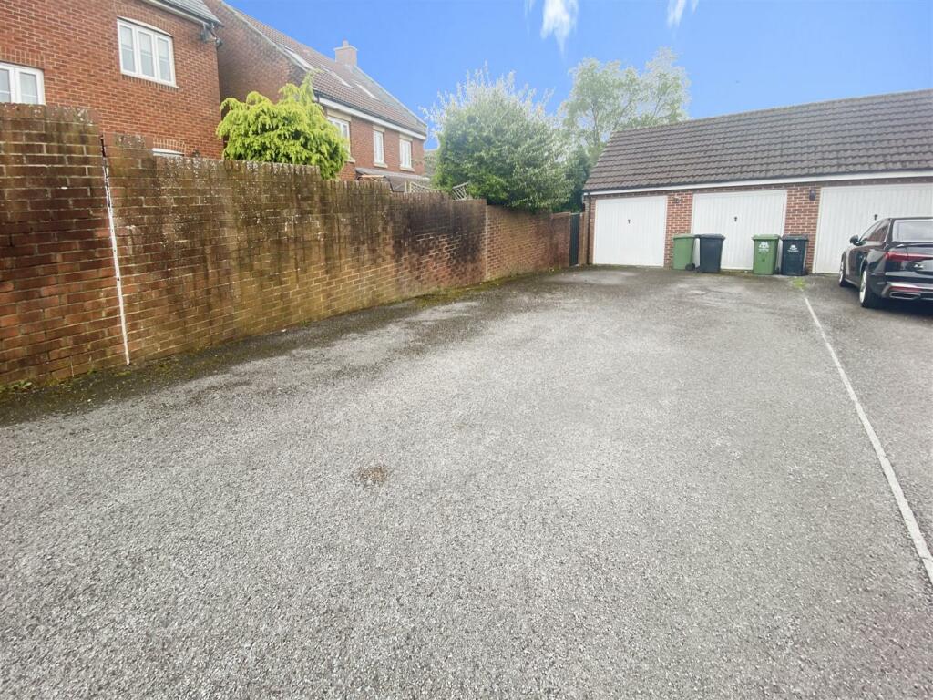 GARAGE AND REAR PARKING AREA