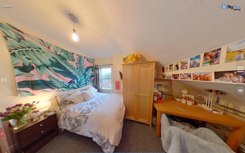 A cozy double bedroom featuring a comfortable d...