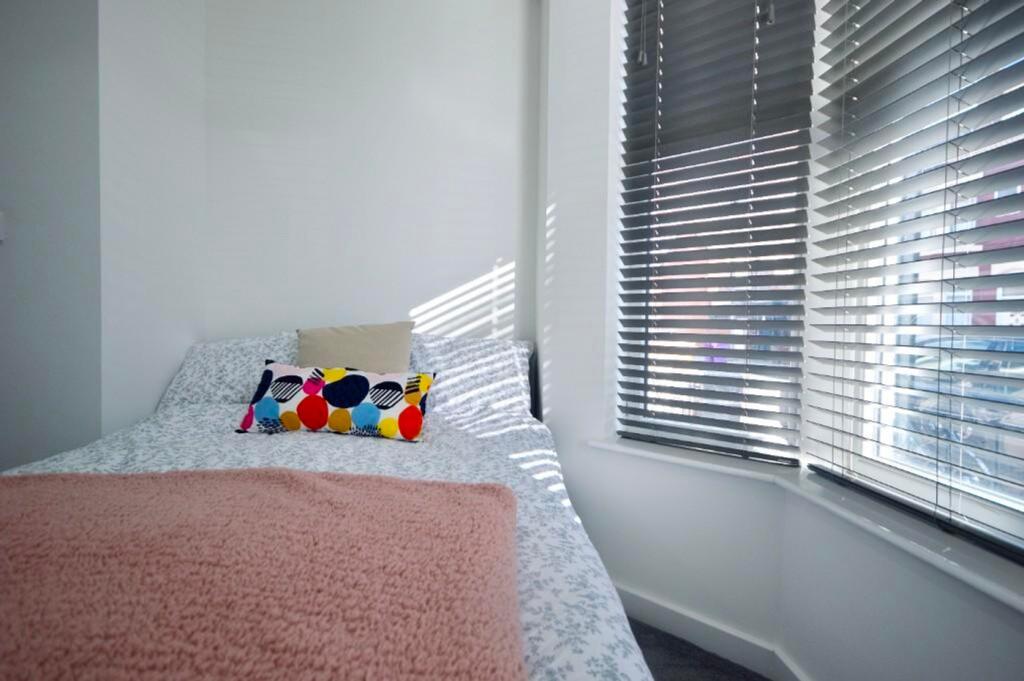 A bright and inviting double bedroom with ample...