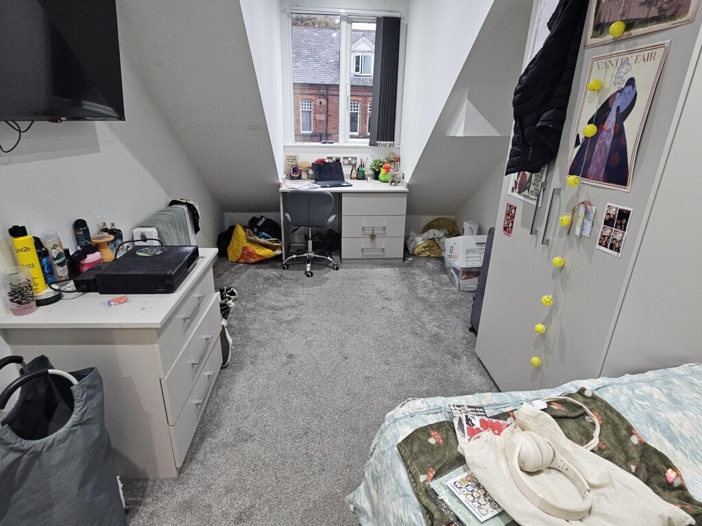 A cozy living room featuring a window that allo...