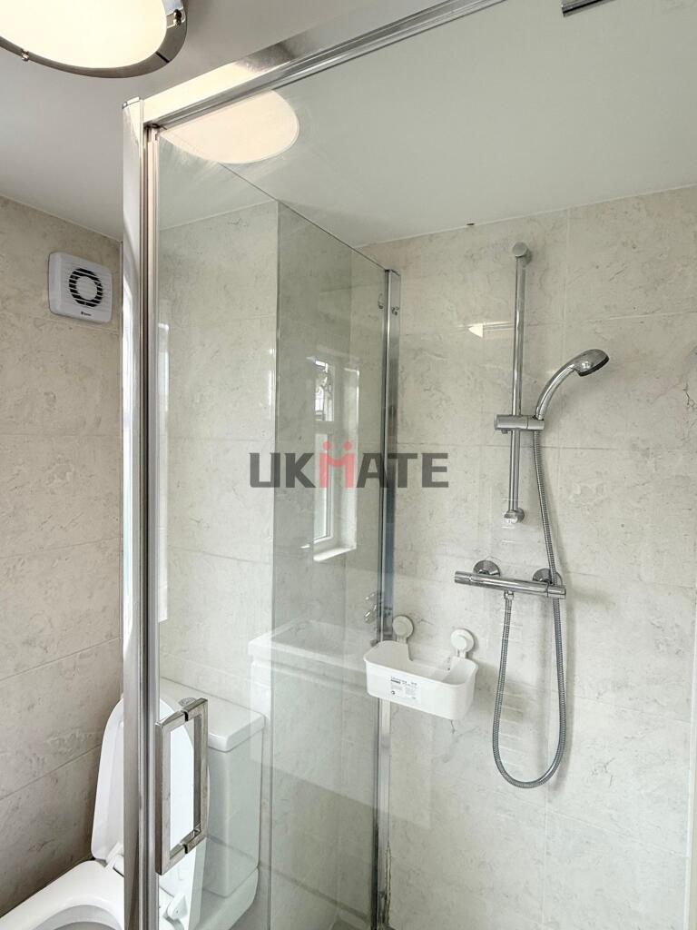 Modern and clean bathroom with a large shower a...