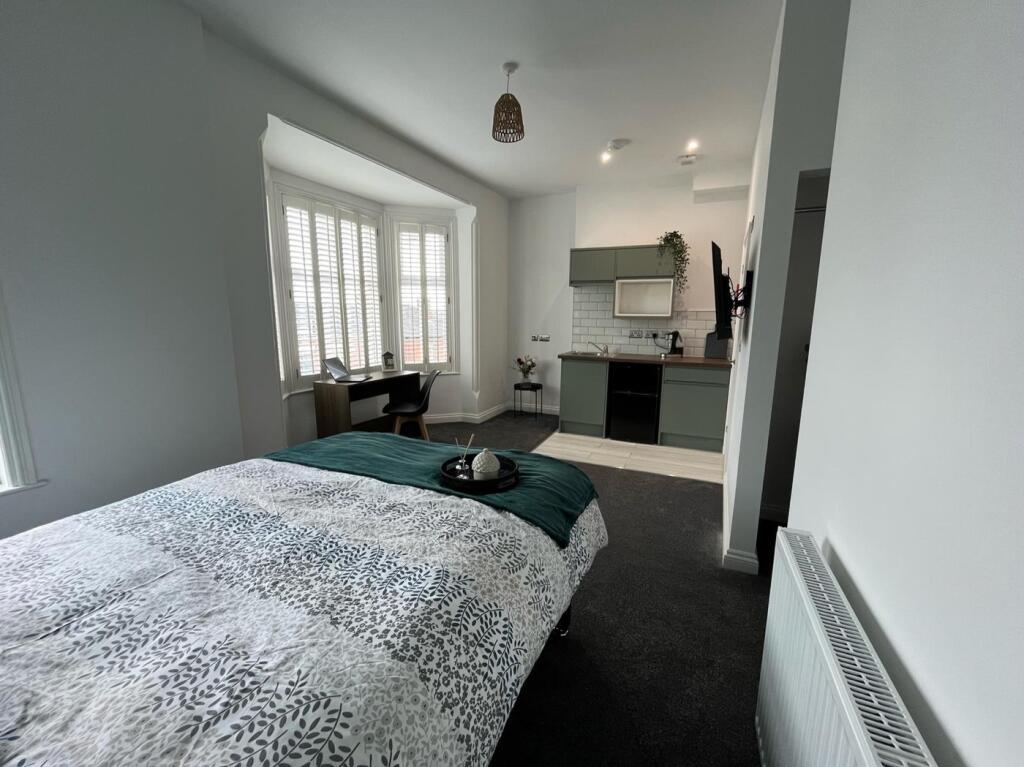 Bright and inviting double bedroom featuring a ...