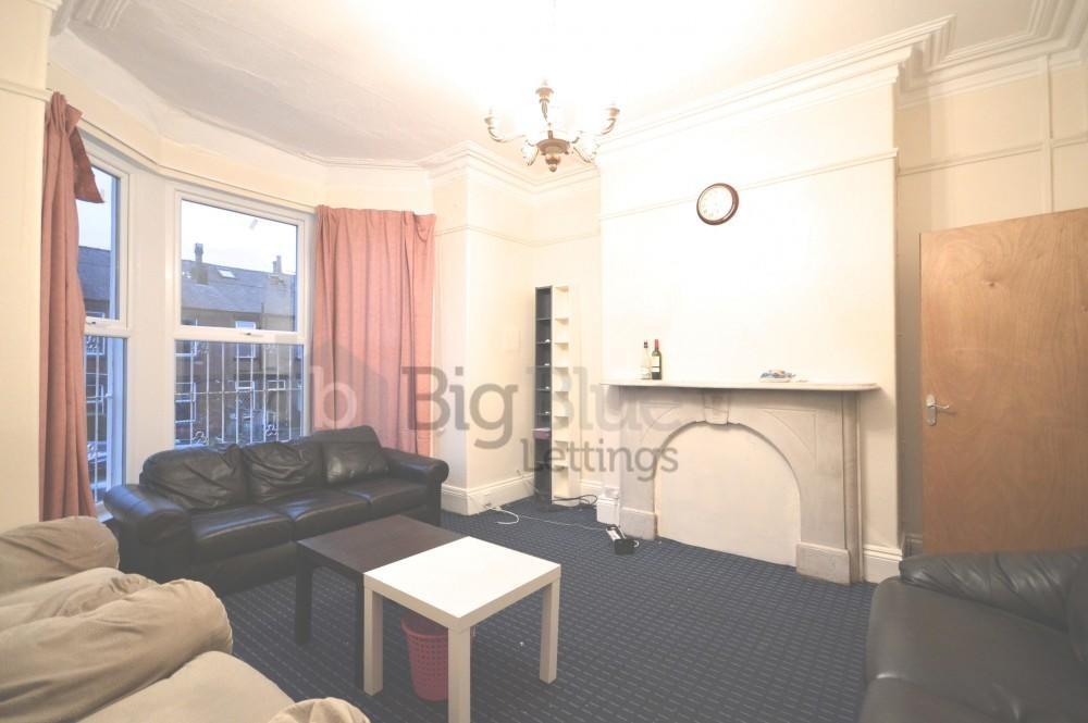 A comfortable living room featuring classic fir...