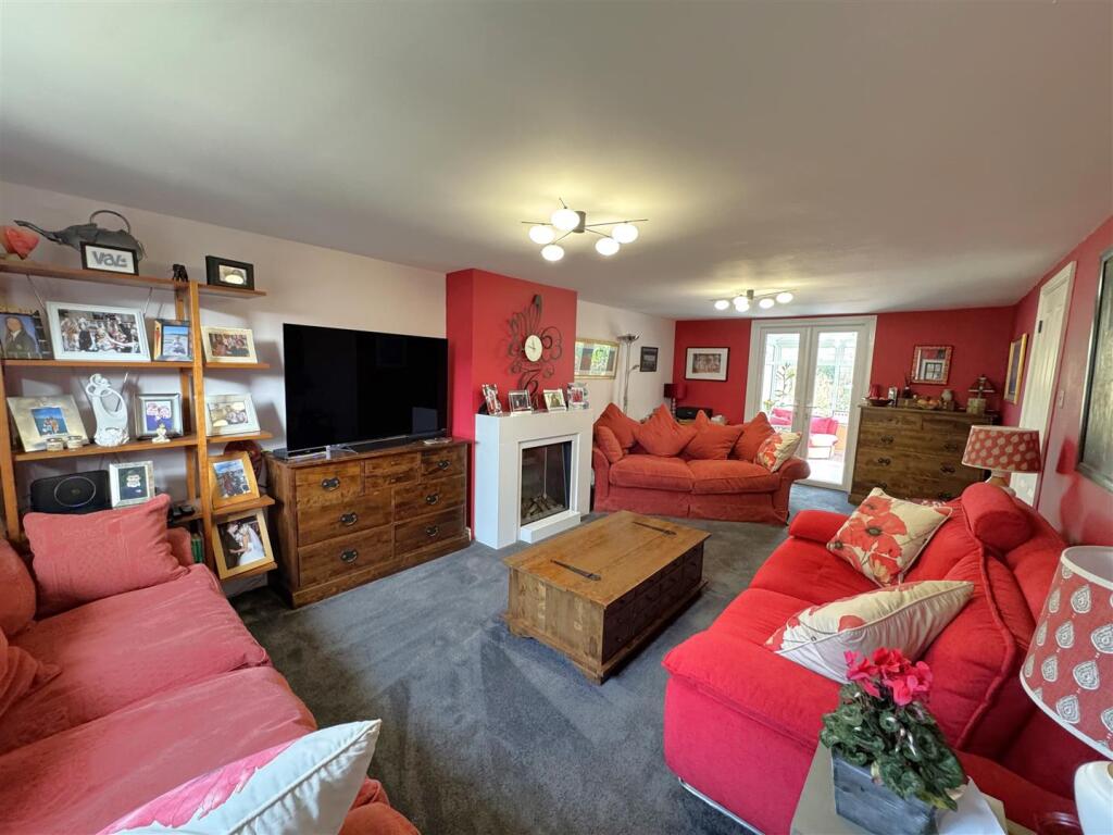 Living Room leading into the conservatory.jpeg