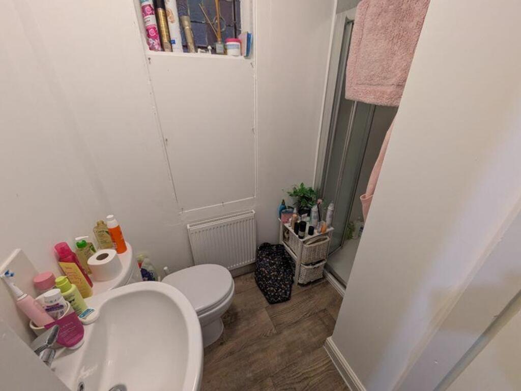 A tidy bathroom featuring essential amenities a...