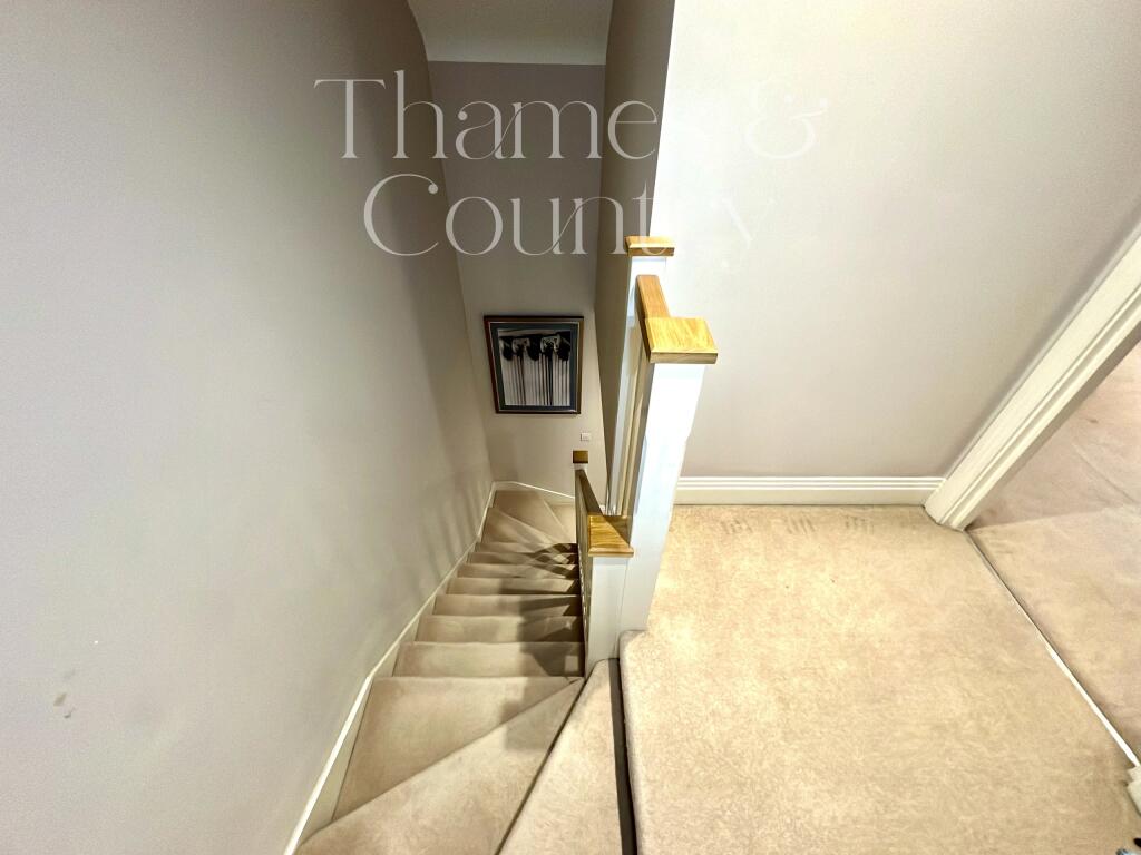 Stairs and landing from primary bedroom top floor