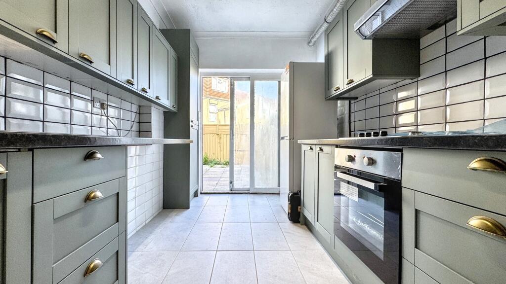 Bright and modern kitchen featuring sleek grey ...