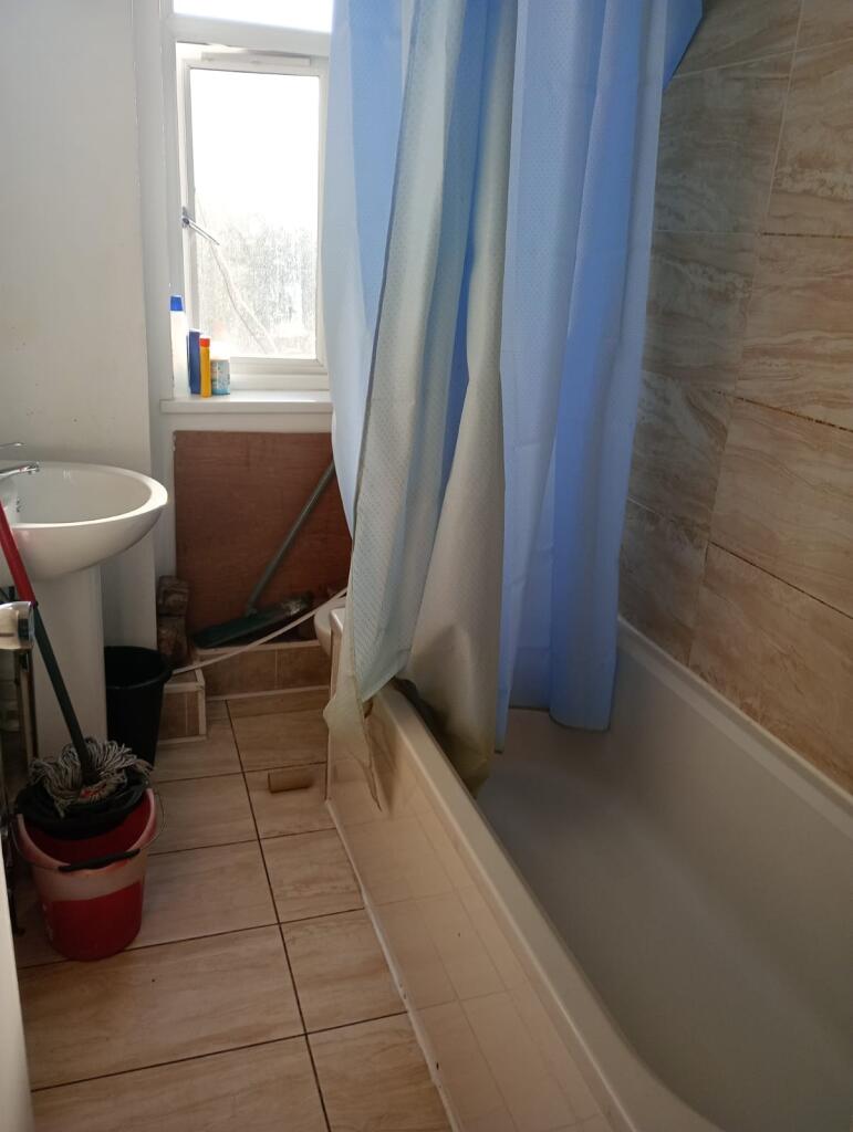 A clean and well-maintained bathroom with a bat...