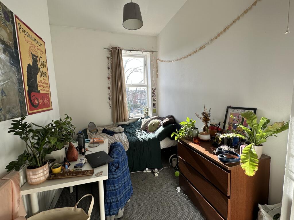 A cozy double bedroom filled with natural light...