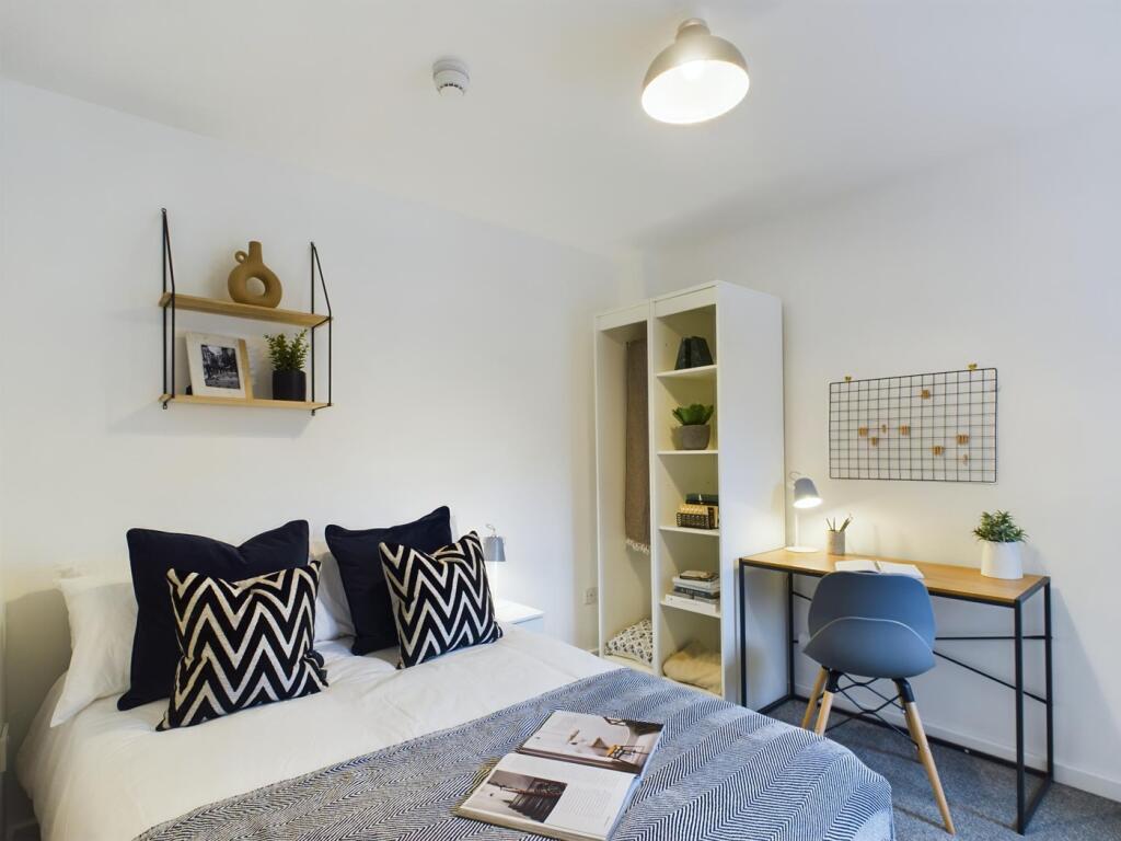 A stylish and inviting double bedroom featuring...