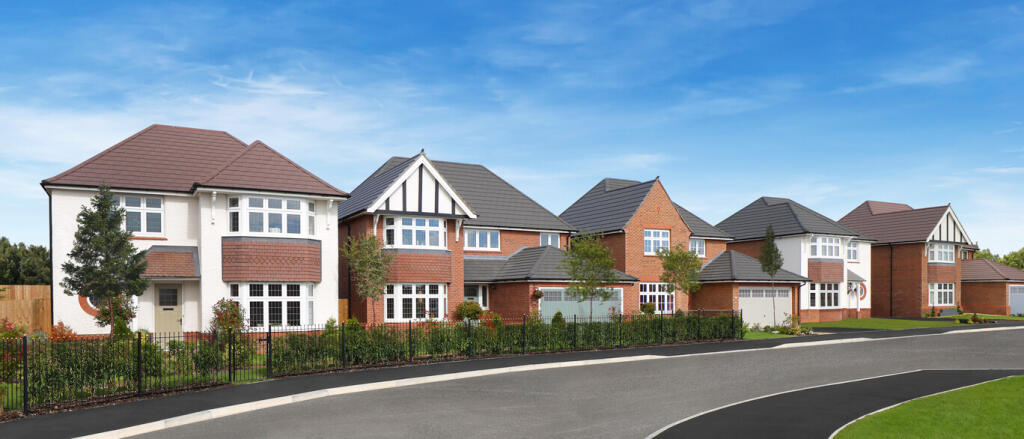 A row of modern detached houses with colourful brick and white exteriors, set along a curved street
