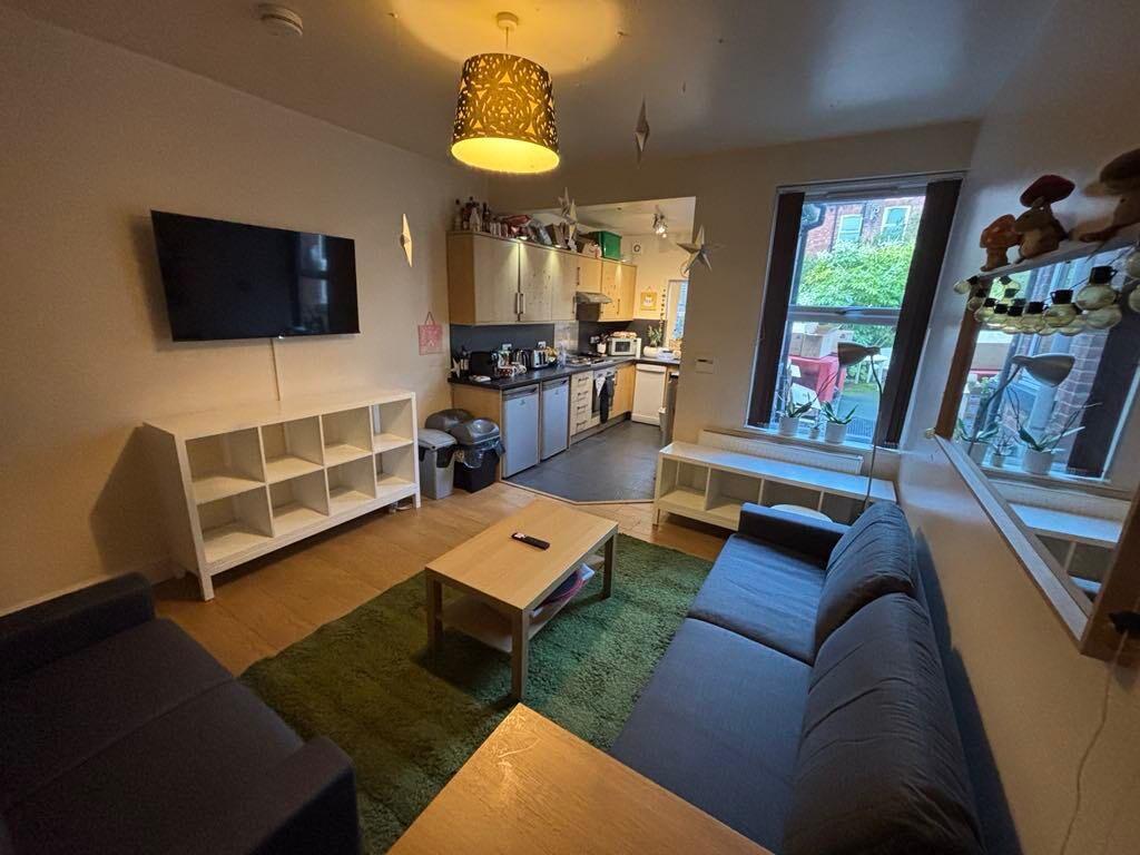 A bright and inviting living room featuring a c...