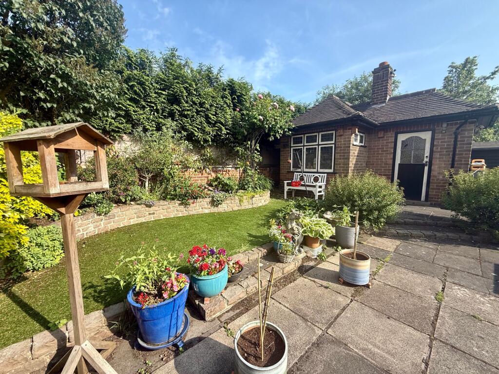 Rear garden/Gardners cottage