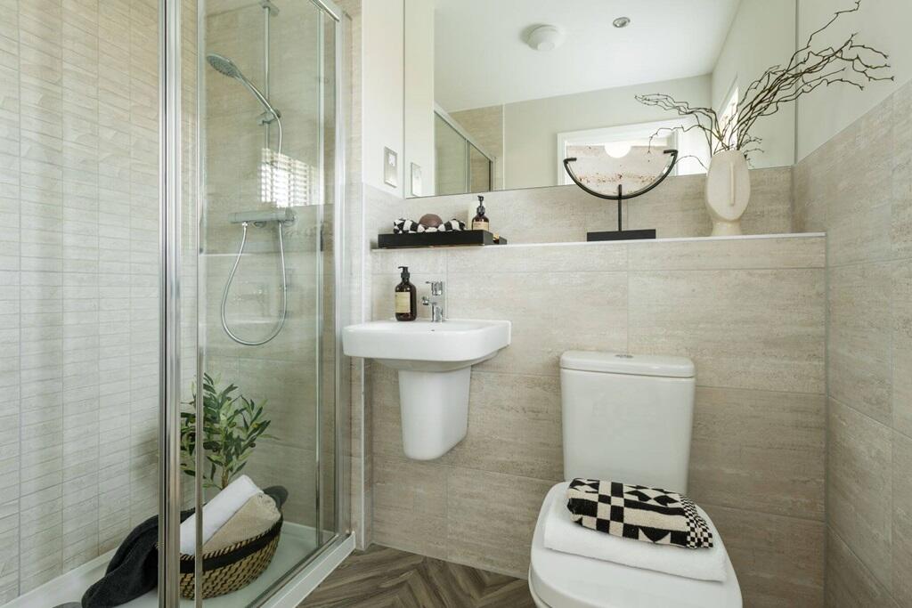 The en suite features high quality fixtures and fittings