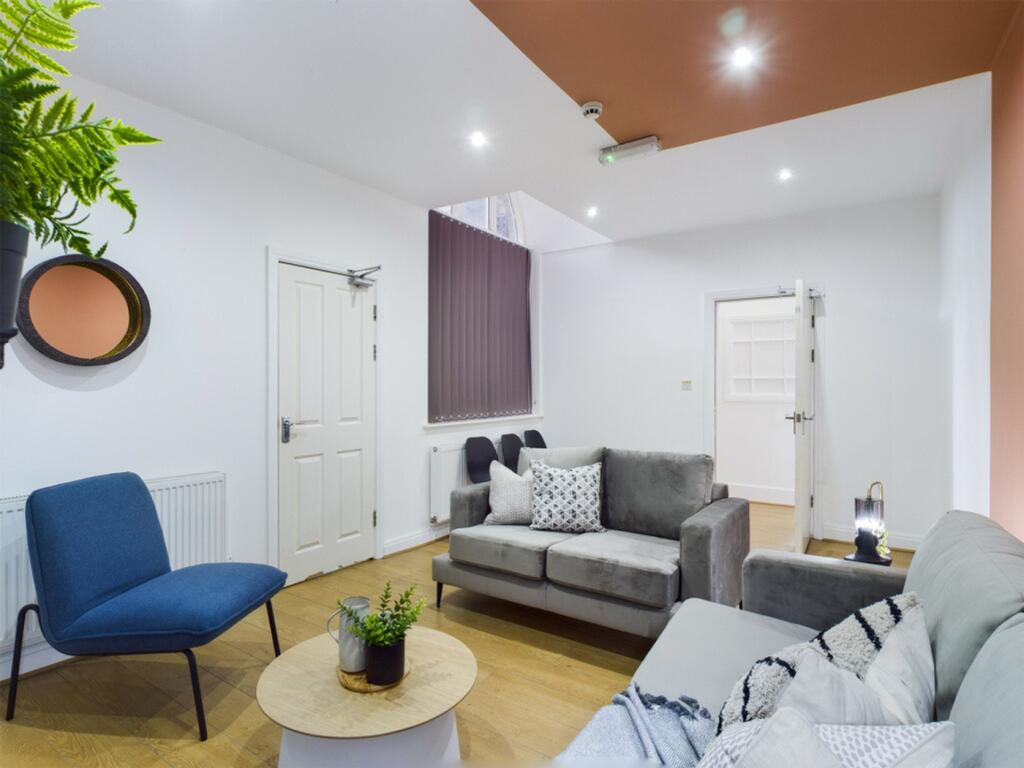 A spacious and stylish modern living room, perf...