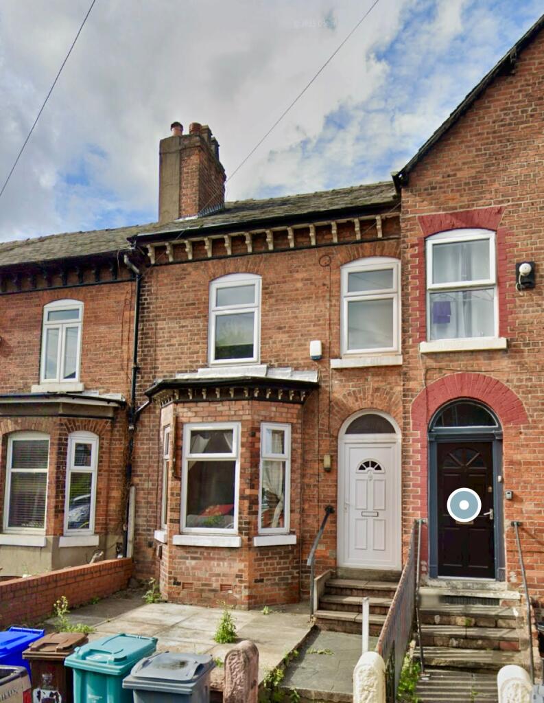 A charming terraced brick house with classic ba...