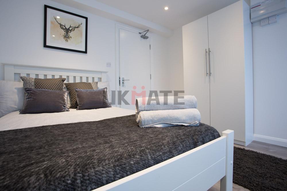 A spacious and well-maintained master bedroom f...