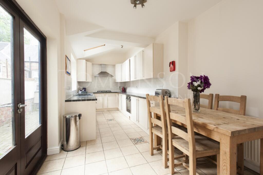 A spacious and inviting kitchen with modern app...