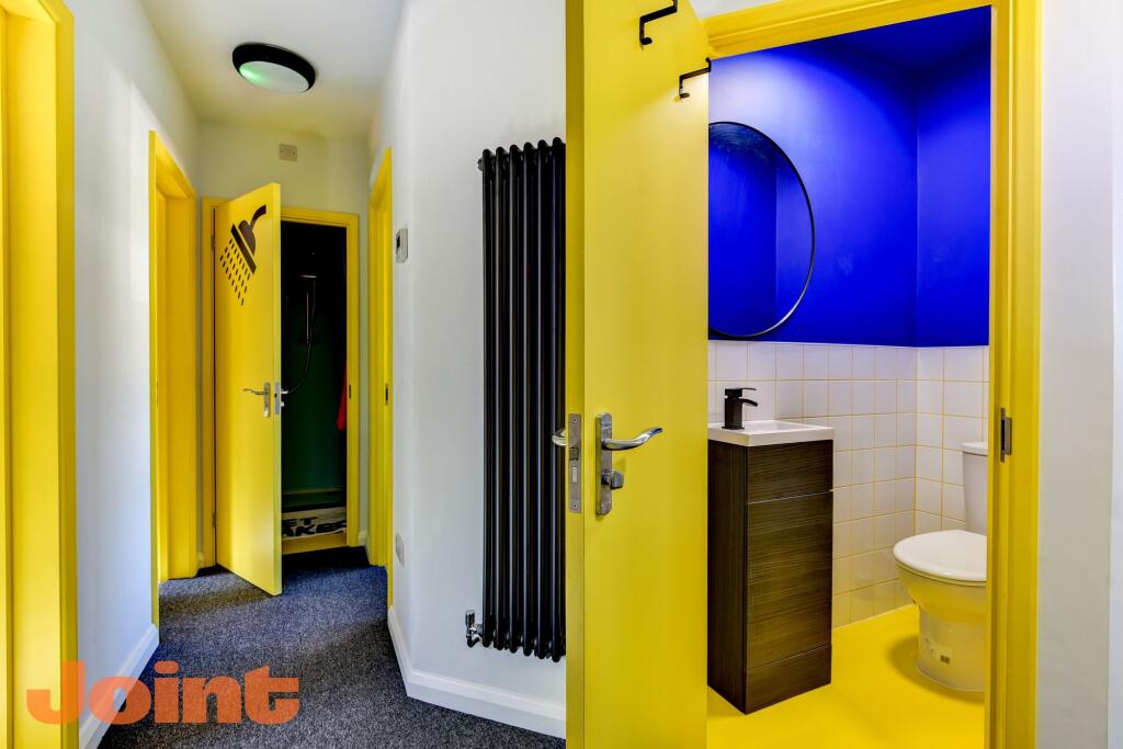 A bright and modern hallway featuring vibrant y...
