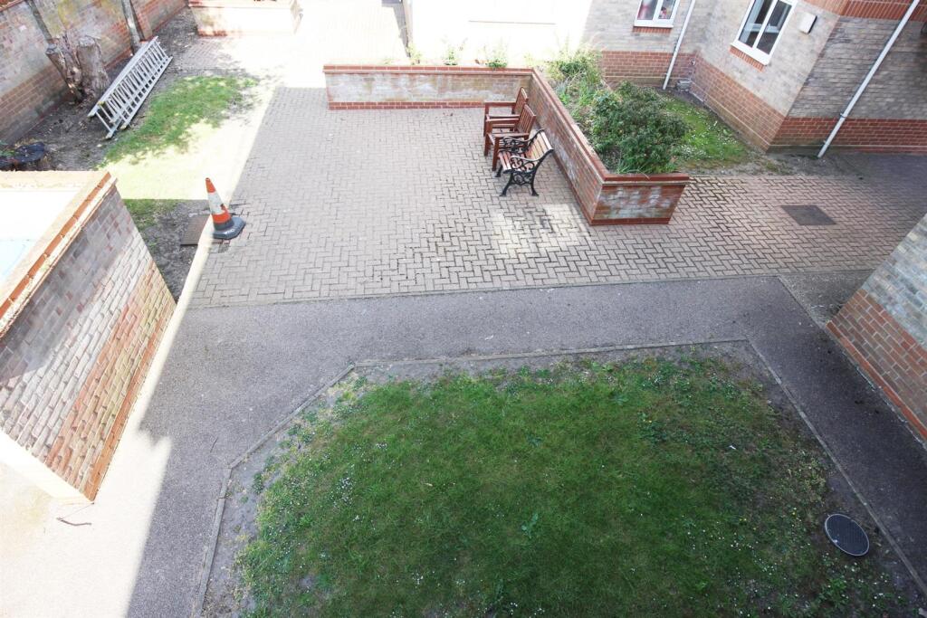 OUTSIDE to rear